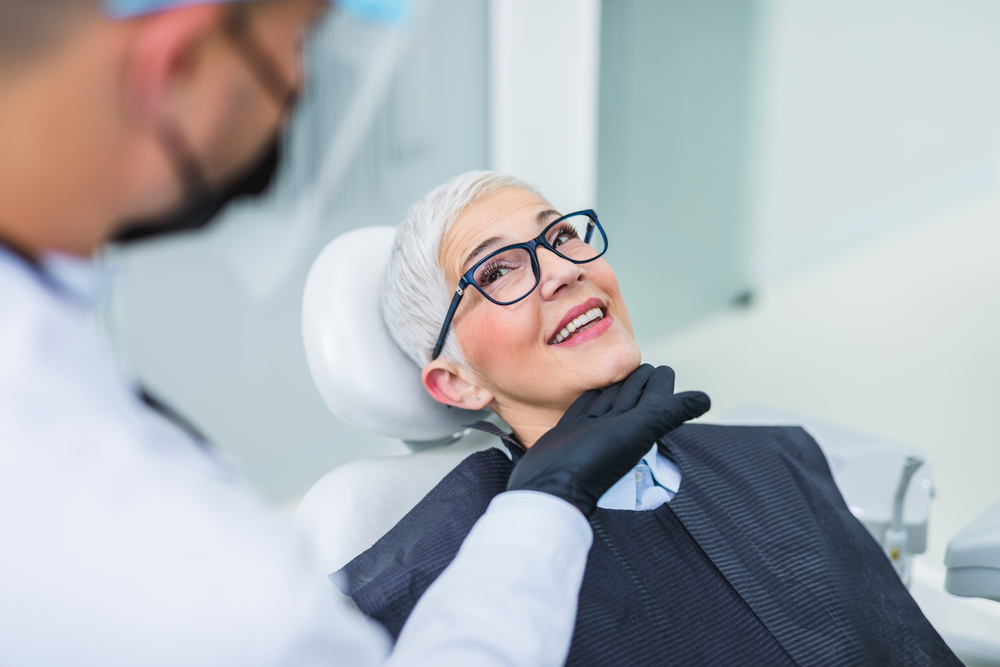 Happy Female Patient Relaxing During Dental Visit – Dentist El Dorado KS