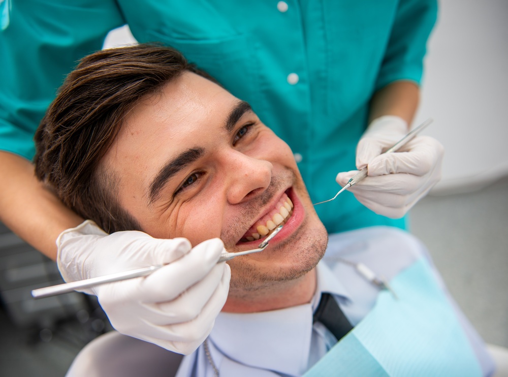 Happy Female Patient Relaxing During Dental Visit – Dentist El Dorado KS