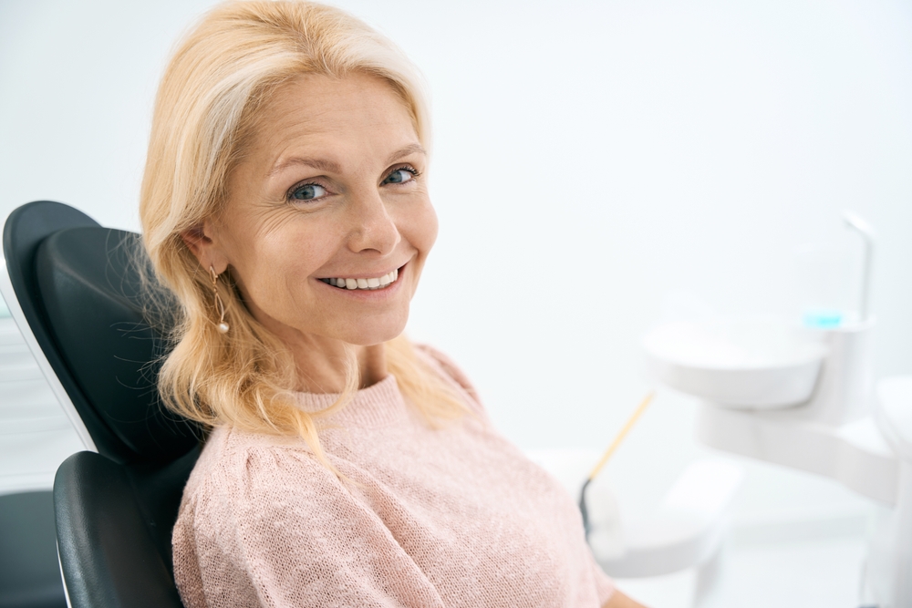Happy Female Patient Relaxing During Dental Visit – Dentist El Dorado KS