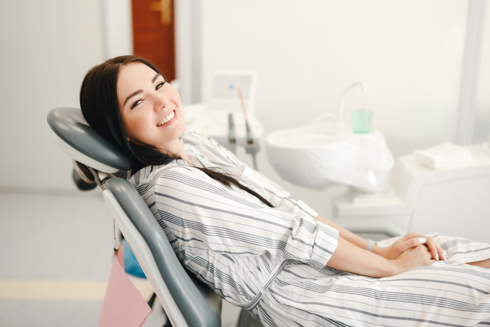 Happy Female Patient Relaxing During Dental Visit – Dentist El Dorado KS