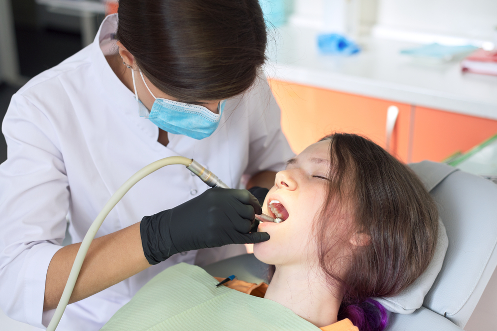 Happy Female Patient Relaxing During Dental Visit – Dentist El Dorado KS