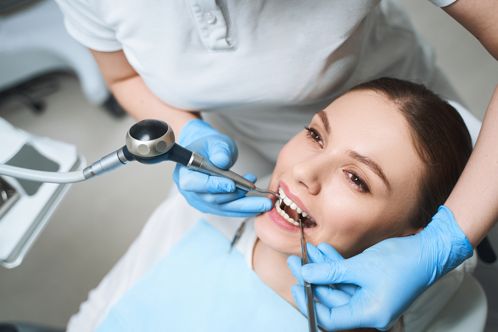 Happy Female Patient Relaxing During Dental Visit – Dentist El Dorado KS