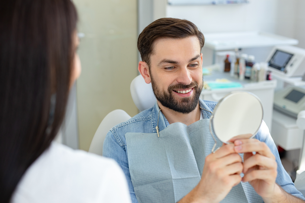 Happy Female Patient Relaxing During Dental Visit – Dentist El Dorado KS